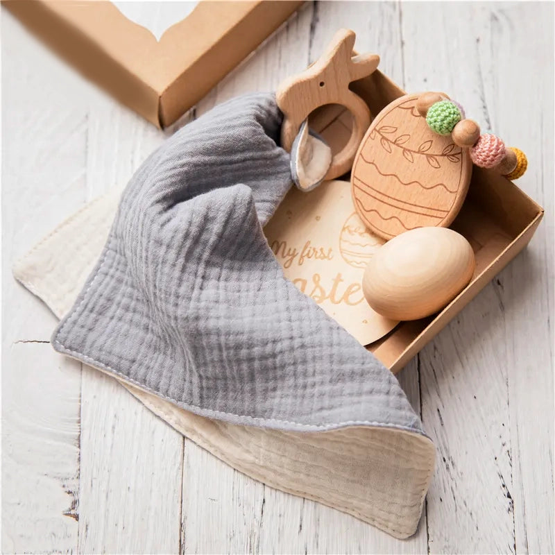 Dubai Online baby shop uae - newborn gift set - swaddle blanket teether rattle milestone wood plaque organic wooden egg for Easter - my first Easter متجر دبي أونلاين للأطفال في الإمارات العربية المتحدة - مجموعة هدايا لحديثي الولادة - قماط وبطانية عضاضة وخشخيشة ولوحة خشبية وبيضة خشبية عضوية لعيد الفصح - عيد الفصح الأول