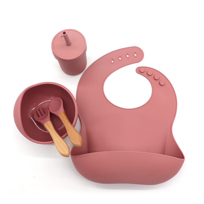 Waterproof silicone bib, cup with a straw, bowl, fork and spoon set for babies kitchen essentials طقم مريلة سيليكون مقاومة للماء وكوب مع شفاطة ووعاء وشوكة وملعقة لمستلزمات مطبخ الأطفال