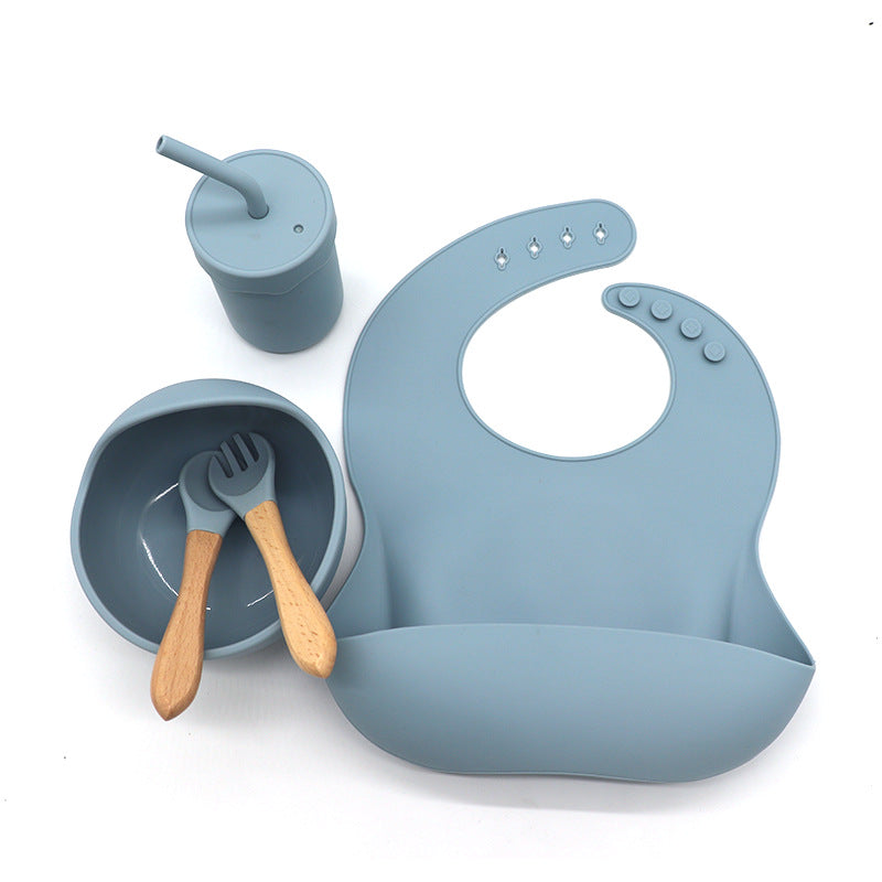 Waterproof silicone bib, cup with a straw, bowl, fork and spoon set for babies kitchen essentials طقم مريلة سيليكون مقاومة للماء وكوب مع شفاطة ووعاء وشوكة وملعقة لمستلزمات مطبخ الأطفال