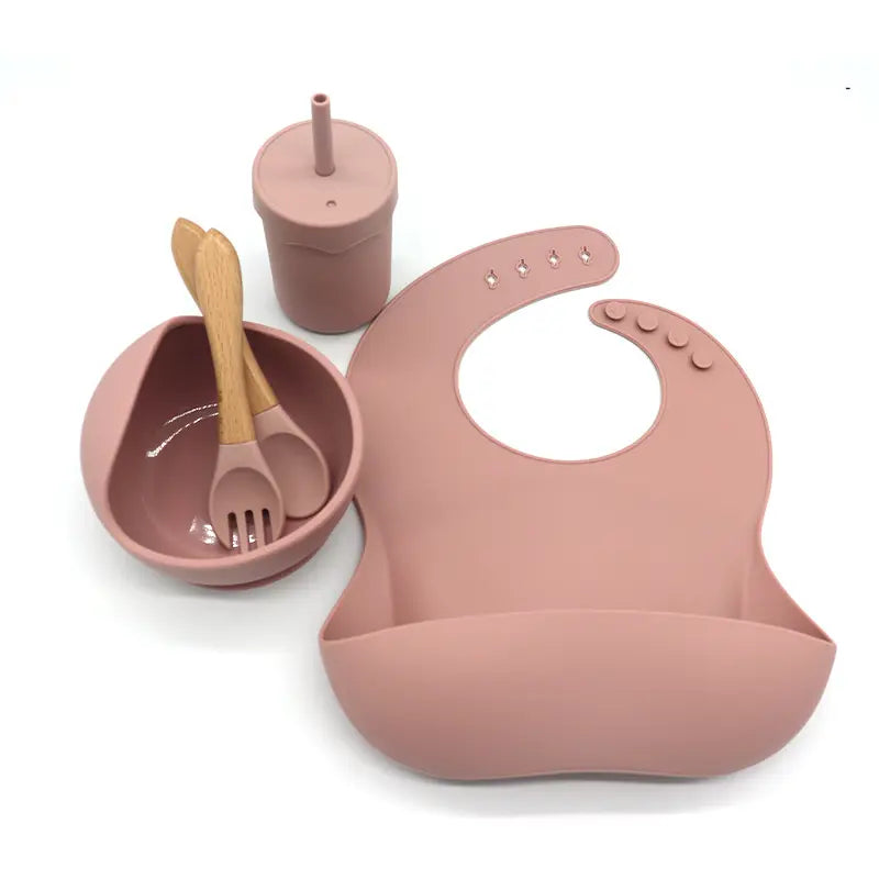 Waterproof silicone bib, cup with a straw, bowl, fork and spoon set for babies kitchen essentials طقم مريلة سيليكون مقاومة للماء وكوب مع شفاطة ووعاء وشوكة وملعقة لمستلزمات مطبخ الأطفال